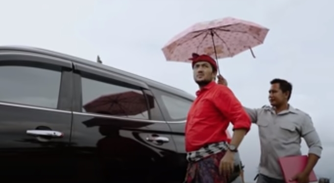 Maksudnya Begini, Bilangnya Begitu | Politik Satire dalam Video Klip “Suud Minum Yan”